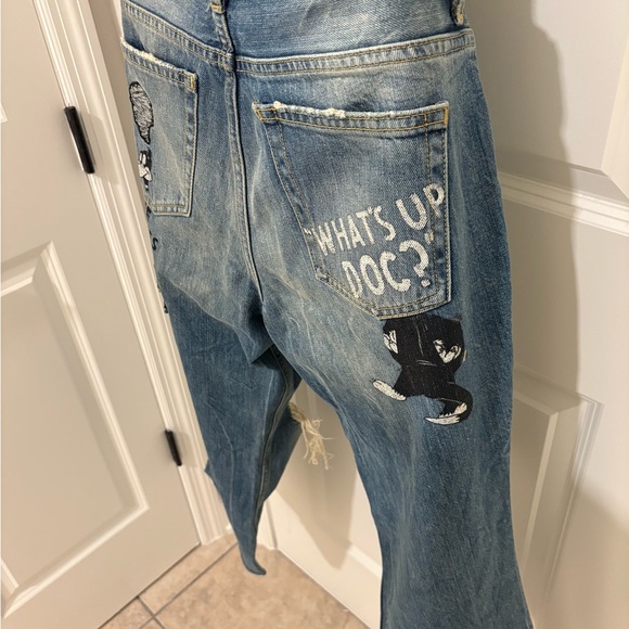 Zara Distressed Blue Denim Jeans with Cartoon Print. Flared ankle cut low rise - Picture 1 of 7